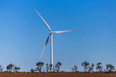 Wind turbine in a Kansas field.の写真素材