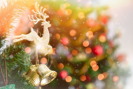 Christmas tree with decorations bokeh blurred glow. Happy New Year and Merry x-mas.の写真素材