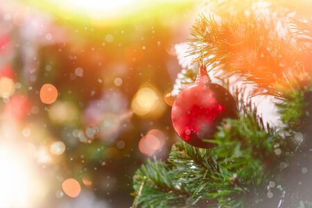 Christmas tree with decorations bokeh blurred glow. Happy New Year and Merry x-mas.の写真素材