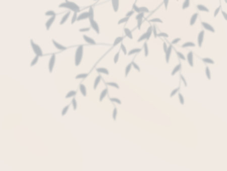 Simple decorative background with shadows of tree leaves on the wall