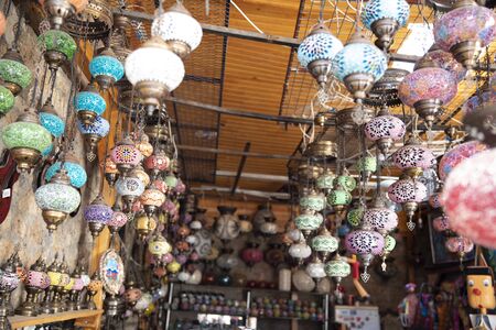 Vintage colorful Turkish lamps on the market roof.