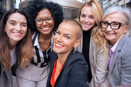 Team of women entrepreneurs having a selfie with an outdoor partner.の写真素材