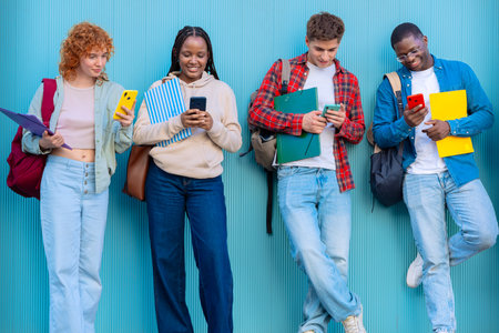 Four students having fun with mobile phones creating content on social media.