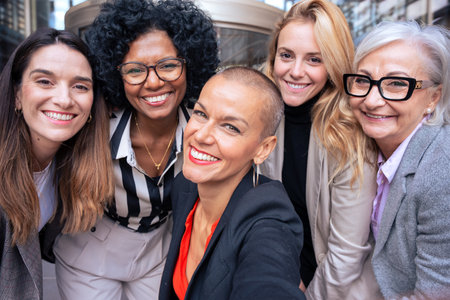 Team of women entrepreneurs having a selfie with an outdoor partner.