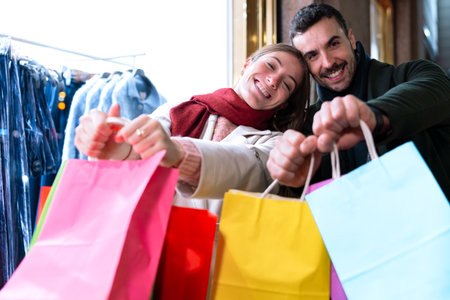 Happy Couple Shopping with Colorful Bags at Night