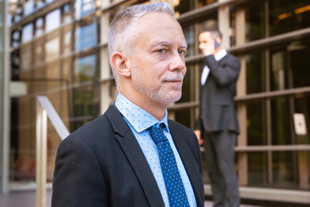 Confident Senior Businessman Outdoors in Professional Attire.の写真素材