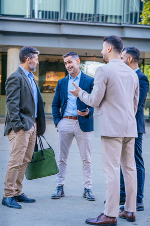 Group of Businessmen Talking Outdoors in a Casual Meeting.Verticalの写真素材