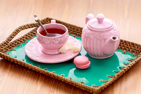 Tea with pink macaroon dates and rock sugar nabotの写真素材