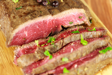 Delicious dinner of rare sliced roast beefの写真素材