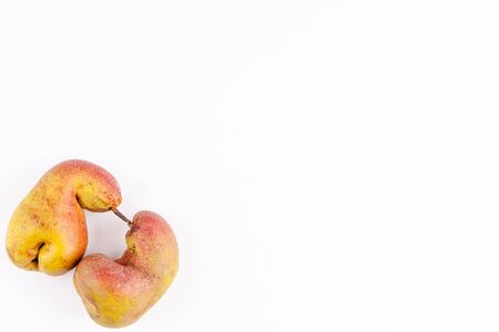 Ugly fruits organic ripe pears on white background, zero waste food concept