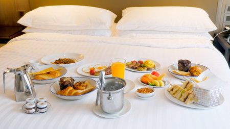 Breakfast in bed in hotel. Room service in modern luxury resortの写真素材