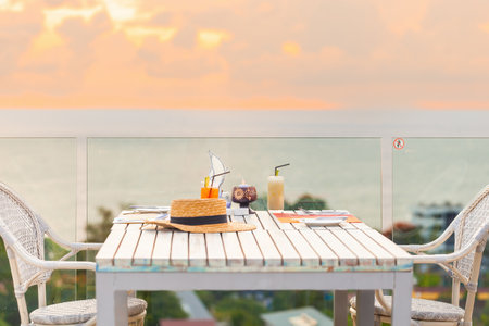 Luxury breakfast table for two with tropical sea view backgroundの写真素材