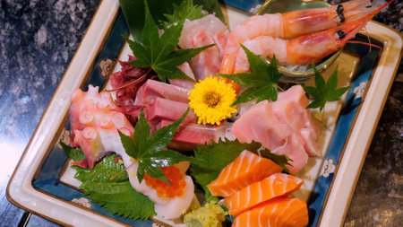 Closeup of raw salmon sashimi in Japanese luxury eateryの写真素材