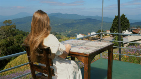 Woman enjoying panoramic mountain viewの写真素材