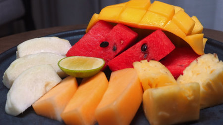 Assorted tropical fruits including mango, watermelon, guava, lime,の写真素材