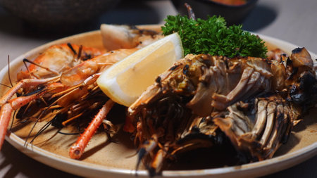 Close-up view of delicious seafood platter featuring grilled shrimps,の写真素材