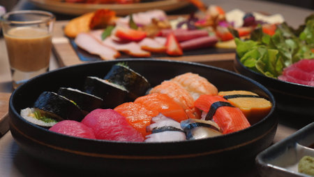 Assorted sushi platter with fresh salmon, tuna, and nigiri rollsの写真素材