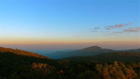Scenic mountain landscape at sunrise with vibrant colors and clearの写真素材