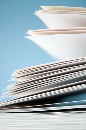 White blank papers on blue background