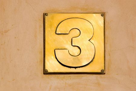 Metallic sign with number threeの写真素材