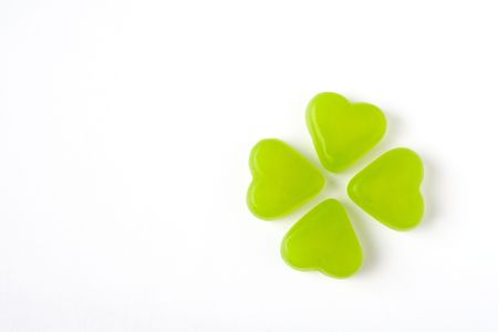 Green heart candy on white isolated backgroundの写真素材