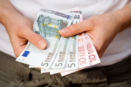 Woman holding euro money in her hands