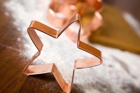 Baking christmas cookies with star and tree motifの写真素材