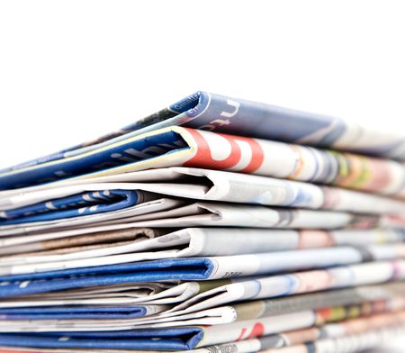 Stack of newspapers on white background
