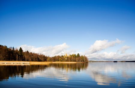 Autumn landscape with water reflectionの写真素材