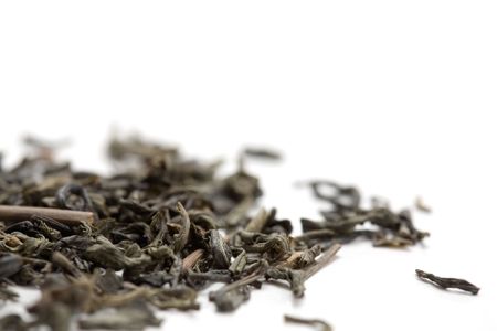 Green tea leaves on white