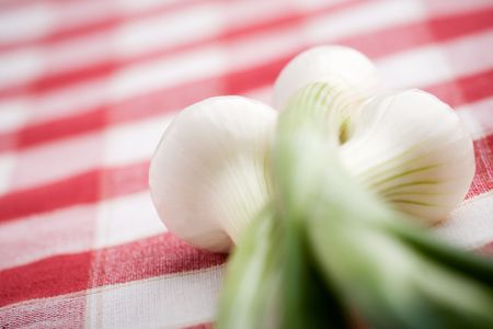 Bunch of fresh onions on kitchen tableの写真素材