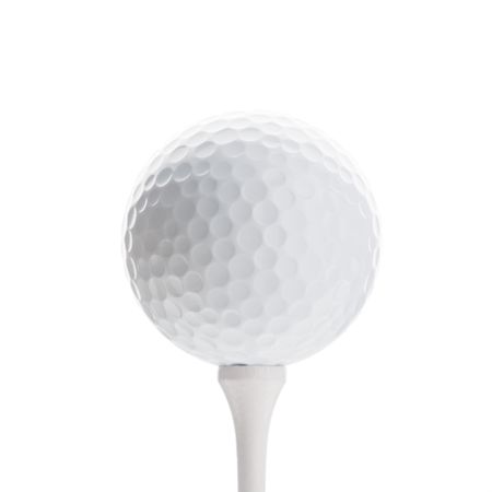 Golfball on white tee, isolated on whiteの写真素材