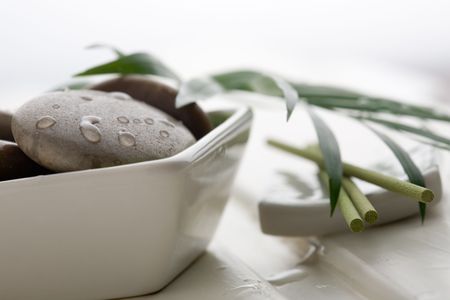 Brown  stones in white bowlの写真素材