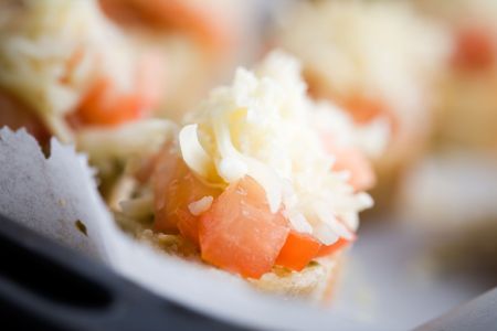 Preparing bruschetta for evening snack