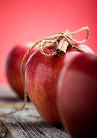 Red apples with cinnamon stick, shallow focusの写真素材