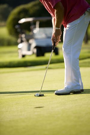 golfers playing golf on beautiful sunny day