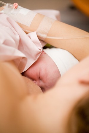 Newborn baby girl right after delivery, shallow focusの写真素材