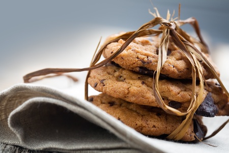 Pile of delicious chocolate chip cookies on tableの写真素材