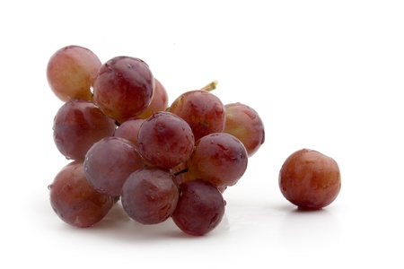 Fresh red grapes on white isolated backgroundの写真素材