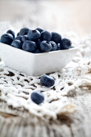 Fresh blueberries on wooden table, selective focusの写真素材