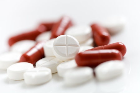 Collection of medicine pills on table, selective focus