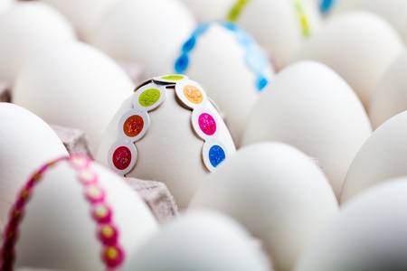 Bunch of white eggs with colorful decorations