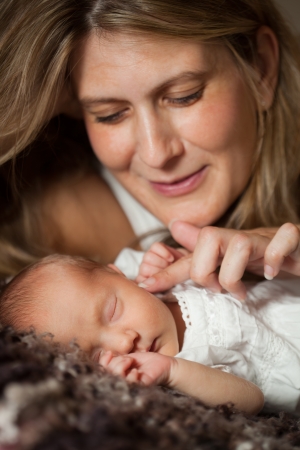 Mother holding her newborn babyの写真素材