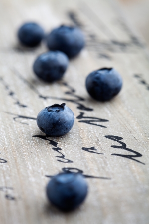Fresh blueberries on wooden table, selective focusの写真素材