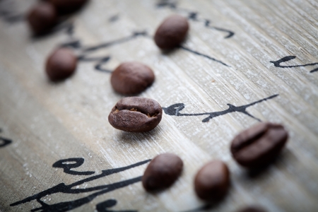 Fresh coffee beans on wooden background, selective focusの写真素材
