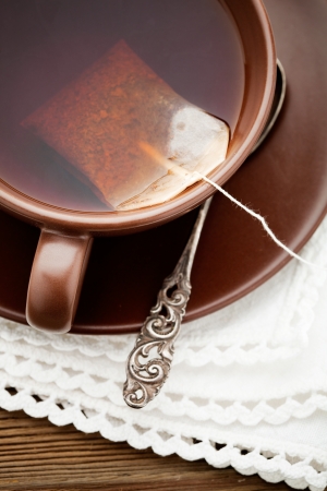 Fresh tea in brown cup, selective focusの写真素材