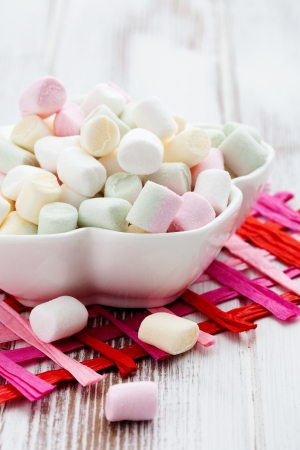 Colorful marshmallows in white bowl, selective focusの写真素材