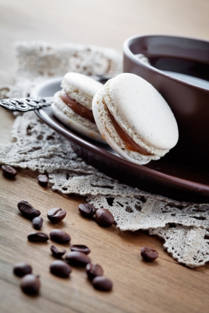 Cup of hot coffee with french macaroonの写真素材
