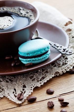 Cup of hot coffee with french macaroonの写真素材