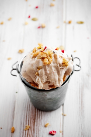 Ice cream with dried fruits and muesliの写真素材